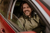 Happy man sitting in car photo