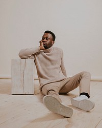 Man wearing beige sweater, khaki pants, minimal fashion