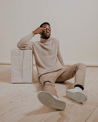 Man wearing beige sweater, khaki pants, minimal fashion