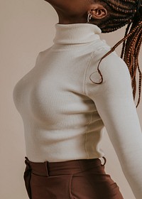 Woman wearing white turtleneck sweater