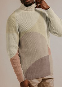 Man wearing beige turtleneck shirt, studio shoot