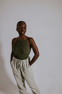 Woman wearing green tank top, sweatpants, loungewear fashion