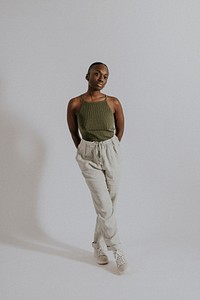 Woman wearing green tank top, sweatpants, loungewear fashion