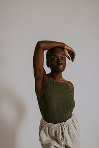 Woman wearing green tank top, sweatpants, loungewear fashion