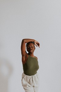 Woman wearing green tank top, sweatpants, loungewear fashion