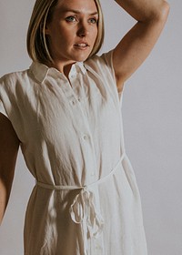 Woman wearing white linen dress, minimal fashion