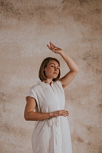 Woman in white linen dress, minimal fashion