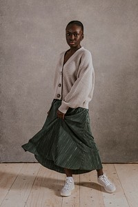 Woman wearing green skirt, wool cardigan, Autumn fashion