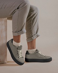 Man wearing sneakers, closeup studio shoot