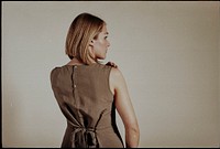 Woman wearing green linen dress, aesthetic photo