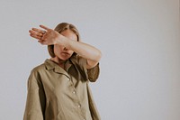 Woman wearing green shirt, pants, minimal loungewear