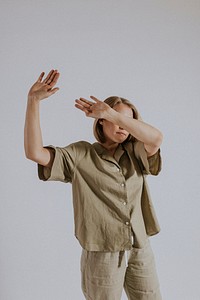 Woman wearing green shirt, pants, minimal loungewear