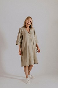 Mature woman wearing linen dress, minimal fashion