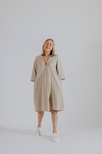 Mature woman wearing linen dress, minimal fashion