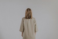 Mature woman wearing linen dress, minimal fashion