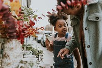 Little girl shopping with mum