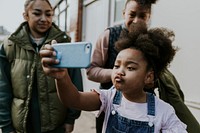 Happy African-American family taking selfie