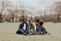 Happy African-American family sitting in a park