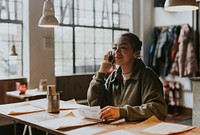 Teenage girl on a phone call at restaurant