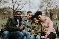 Happy African-American family sitting in a park