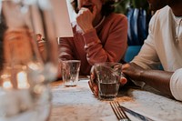 Woman checking menu at restaurant