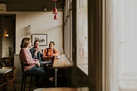 Diverse friends having morning coffee at a cafe