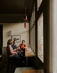 Diverse friends having morning coffee at a cafe