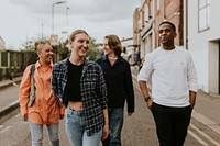 Cheerful diverse friends walking in the city