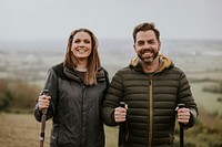 Happy couple trekking on mountain together