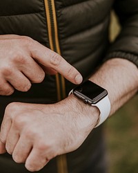 Man tapping on smartwatch screen