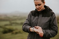 Woman using smartwatch, fitness tracker