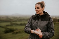 Woman using smartwatch, fitness tracker