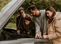 Family with broken car photo