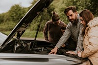 Family with broken car photo