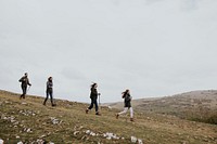 Family hiking on mountain, outdoor activity