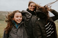 Kid hiking with family on windy day