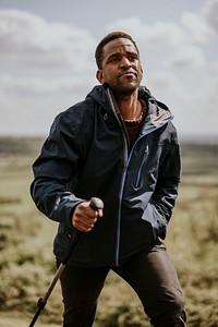 African man wearing blue windbreaker, men's apparel photo