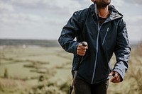 African man wearing blue windbreaker, men's apparel photo