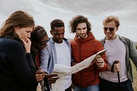 Group of friends looking at map photo