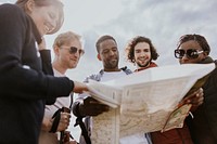 Group of friends looking at map photo