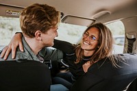 Couple hugging in car photo