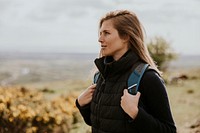 Woman hiking on hill, outdoor activity photo