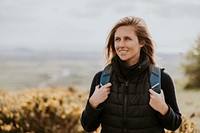 Woman hiking on hill, outdoor activity photo