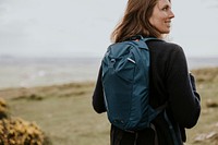 Woman with backpack for hiking, winter apparel photo