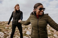 Happy women hiking together, outdoor activity