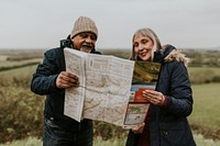 Senior couple looking at map, outdoor travel