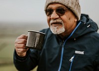 Senior camping man drinking coffee