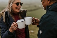 Senior camping couple drinking coffee