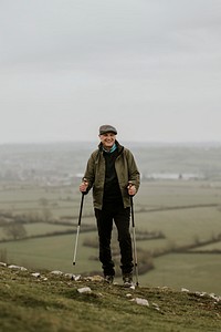 Senior man hiking mountain, countryside, outdoor travel