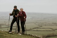 Senior couple hiking mountain, countryside, outdoor travel